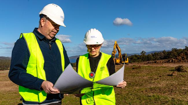 Housing Minister Nic Street looks at plans with CEO of Housing Tasmania Eleri Morgan-Thomas at the new parcel of land at Huntingfield which is being developed into housing. Picture: Linda Higginson