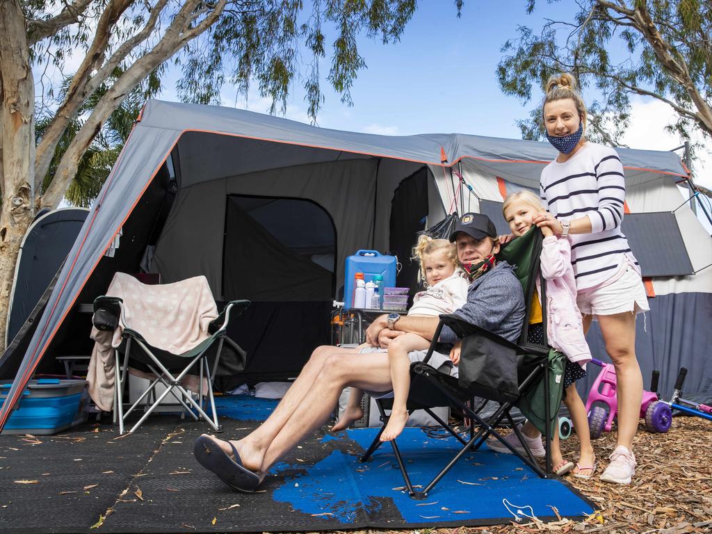 Laura and Peter Yeo from Tamworth camping with daughters Millie 4, and Bella 5 at Noosa River Caravan Park are facing the prospect of spending the three-day lockdown in their tent by the Noosa River. Picture Lachie Millard