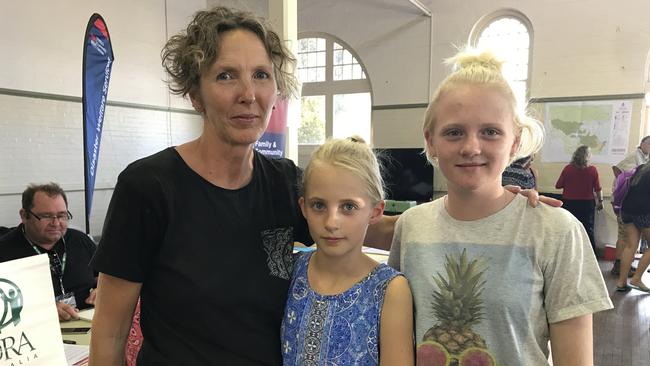 Jani Klotz, 52, with her daughters Lucy, 14, and Alexandra, 9. Their home has been destroyed by fire. Picture: Claire Bickers