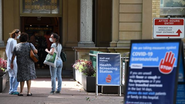 Staff wearing face masks outside the Royal Prince Alfred Hospital (RPA) in Camperdown. (AAP Image/Dean Lewins)