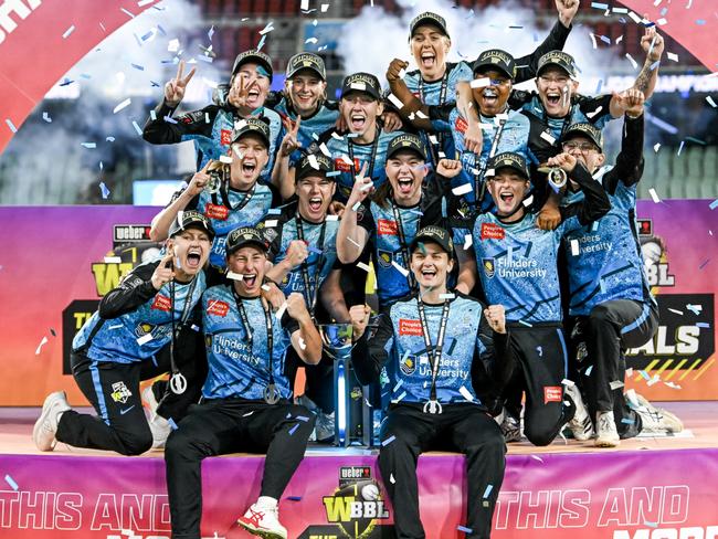 ADELAIDE, AUSTRALIA - DECEMBER 02:The Strikers celebrate on the podium  after winning  the WBBL Final match between Adelaide Strikers and Brisbane Heat at Adelaide Oval, on December 02, 2023, in Adelaide, Australia. (Photo by Mark Brake - CA/Cricket Australia via Getty Images)