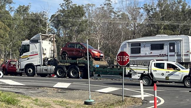 A critically injured woman has had to be cut free from her vehicle following a horror crash between her car and a truck on the Bruce Hwy near Bauple, on Monday July 10, 2023.