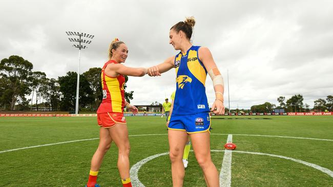 PERTH, AUSTRALIA - MARCH 15: Leah Kaslar of the Suns bumps elbows with Emma Swanson of the Eagles during the 2020 AFLW Round 06 match between the West Coast Eagles and the Gold Coast Suns at Mineral Resources Park on March 15, 2020 in Perth, Australia. (Photo by Daniel Carson/AFL Photos via Getty Images)