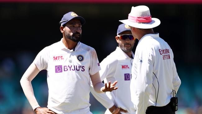 SYDNEY, AUSTRALIA - JANUARY 10: Mohammed Siraj of India stops play to make a formal complaint about some spectators in the bay behind his fielding position during day four of the Third Test match in the series between Australia and India at Sydney Cricket Ground on January 10, 2021 in Sydney, Australia. (Photo by Cameron Spencer/Getty Images)