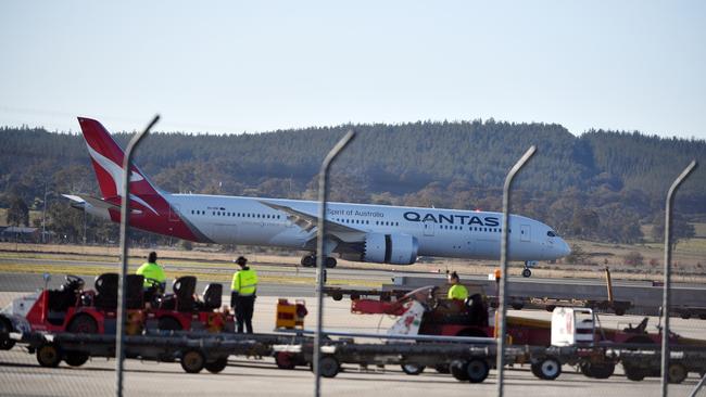 A Qantas aircraft landing at Canberra Airport. Picture: AAP