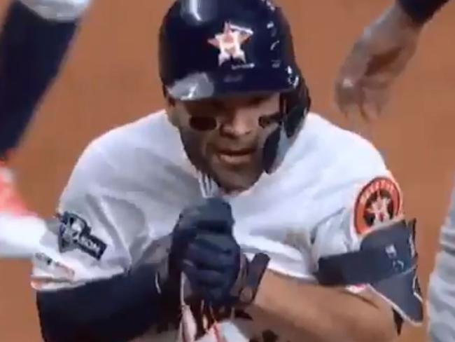 Jose Altuve holds his jersey after his home run of game six of the American League Championship Series.