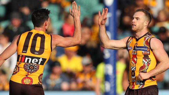 Tom Mitchell and Jaeger O’Meara celebrate a goal for the Hawks. Picture: Getty Images