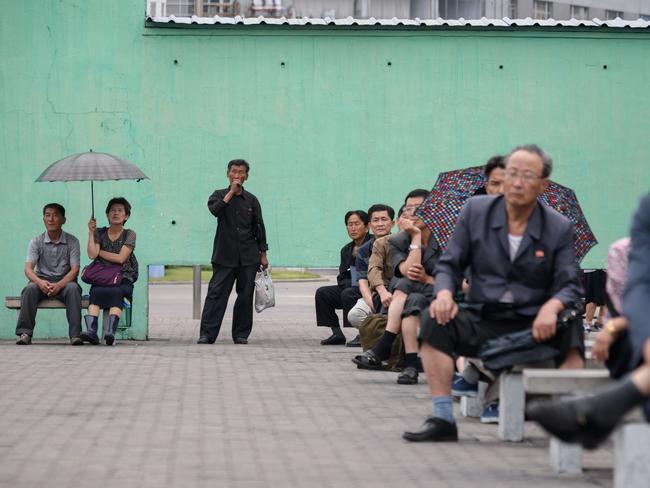 North Koreans watching TV at a central railway station in Pyongyang after the summit said they were as pleased as Mr Trump — but for different reasons. Picture: AFP Photo / Ed Jones