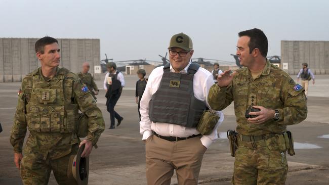 Prime Minister Scott Morrison beside Defence Force Chief General Angus Campbell (left) and Colonel Jason Groat at the Taji Military Complex in Iraq. Picture: Supplied