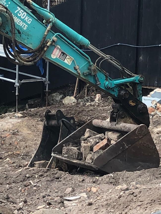 The bucket of the excavator on a building demolition site on North Harbour St, Balgowlah, that uncovered the human remains. Picture: Jim O'Rourke