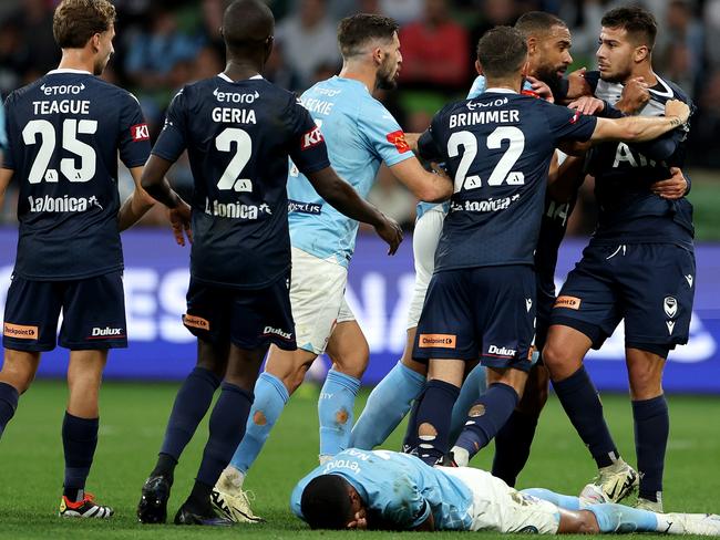 MELBOURNE, AUSTRALIA - MAY 05: Players come together after Zinedine Machach of Melbourne Victory fouls Leonardo Natel of Melbourne City during the A-League Men Elimination Final match between Melbourne Victory and Melbourne City at AAMI Park, on May 05, 2024, in Melbourne, Australia. (Photo by Jonathan DiMaggio/Getty Images)