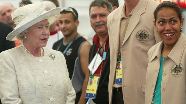 Queen Elizabeth II talks with Cathy Freeman.