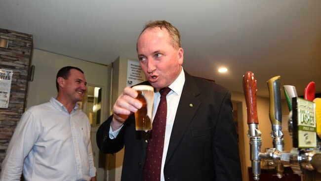 THIRSTY WORK: Disgraced former deputy prime minister Barnaby Joyce lubricates the ol’ vocal cords on the campaign trail ... possibly ahead of another spirited radio interview. Picture: Dan Peled/AAP