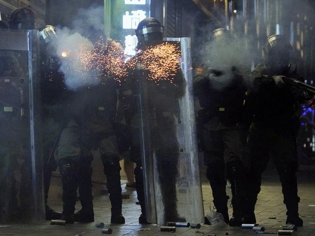 Police fire tear gas to protesters in the Kowloon area of Hong Kong on Monday. Picture: AP