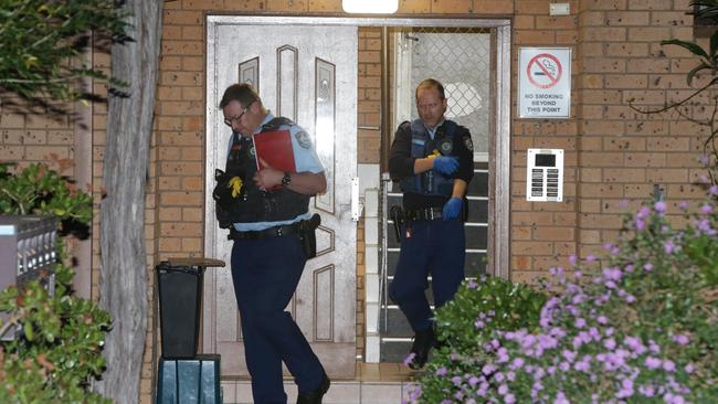 Police assess the scene where a woman was found stabbed multiple times. Picture: Bill Hearne