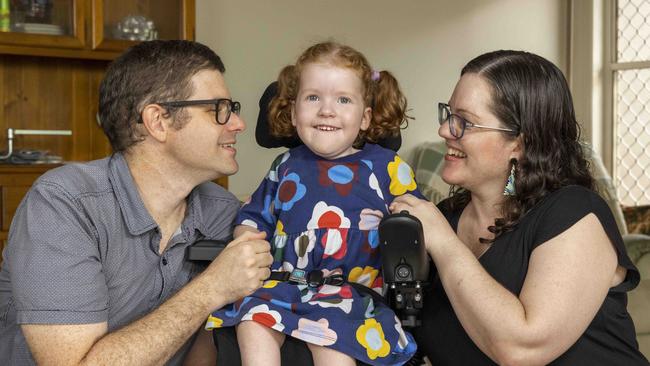 ‘Screening for SMA is so important because every day means loss of function,’ says Katie McIntosh, with husband Clayton and daughter Reena. Picture: Glenn Hunt