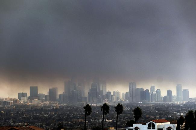 Thick, heavy smoke shrouds downtown LA. Picture: AP