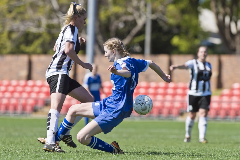 Chantal Frohloff (left) of Willowburn is tackled by Tobie Andison of Rockville in Toowoomba Football League Premier Women grand final at Clive Berghofer Stadium, Sunday, September 9, 2018. Picture: Kevin Farmer