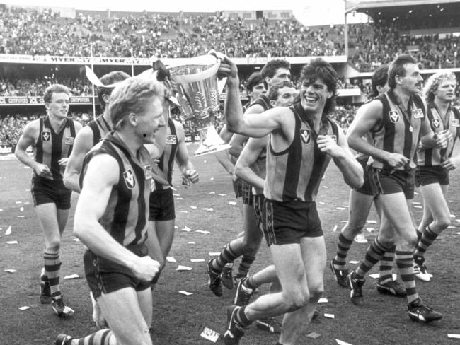 Andy Collins and Gary Ayres with Hawthorn’s 1988 premiership cup.