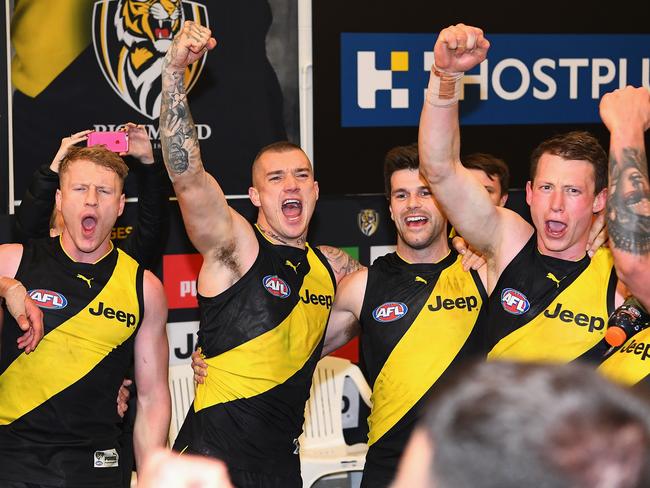 Josh Caddy, Dustin Martin, Trent Cotchin and Dylan Grimes celebrate in the rooms after beating Geelong. Picture: Quinn Rooney/Getty