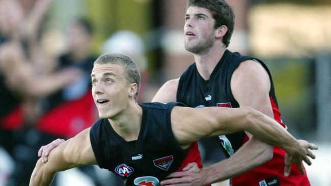 Ted Richards and Sam Hunt at Essendon training.