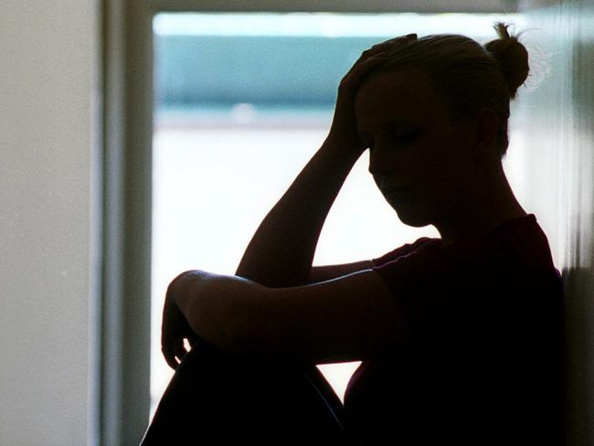 21 Dec 2001 Silhouette of young woman seated in doorway, date rape victim in Adelaide. Sexual Assault crime sa sex generic