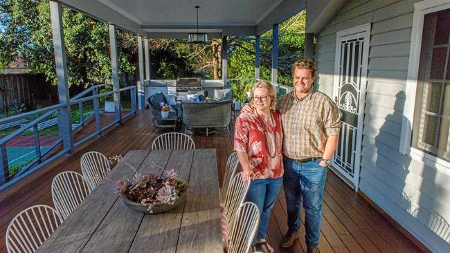 LONG-TERM OUTLOOK: Angela and Andrew Mula are happy with the renovated deck area at the rear of their Grafton home. The upgrade was about making the home liveable. Picture: Adam Hourigan