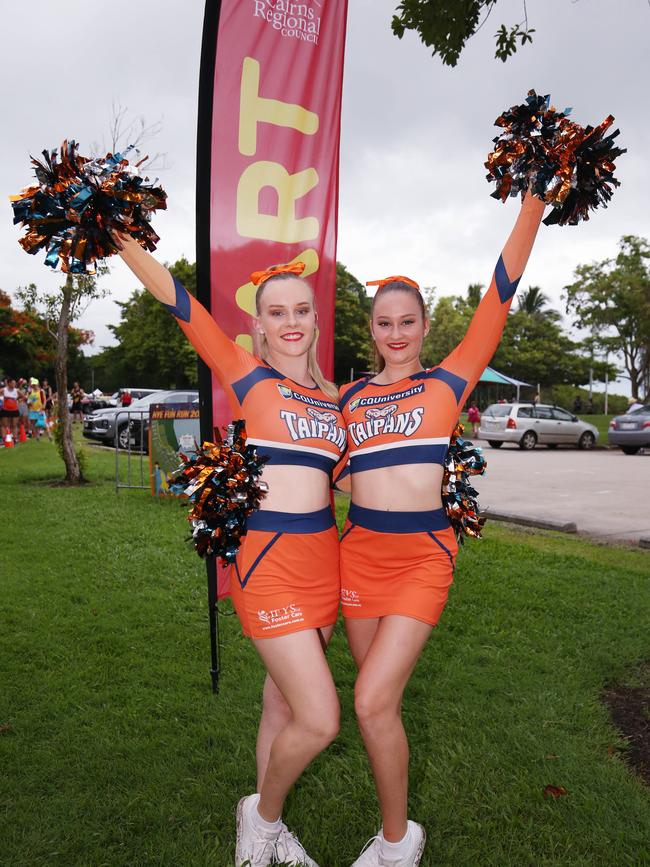 Taipans cheer leaders Hannah Edwards and Annika Vearing at the Cairns Regional Council's New Year's Eve superhero fun run on the Cairns Esplanade. Picture: Brendan Radke