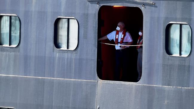 Holland America's cruise ship Rotterdam's staff members look on as they head to dock in Fort Lauderdale, Florida. Picture: AFP.