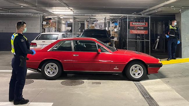 Police check out Cameron Smith's recovered Ferrari at M-City Clayton, after it was stolen hours earlier in South Yarra. Picture: Supplied.