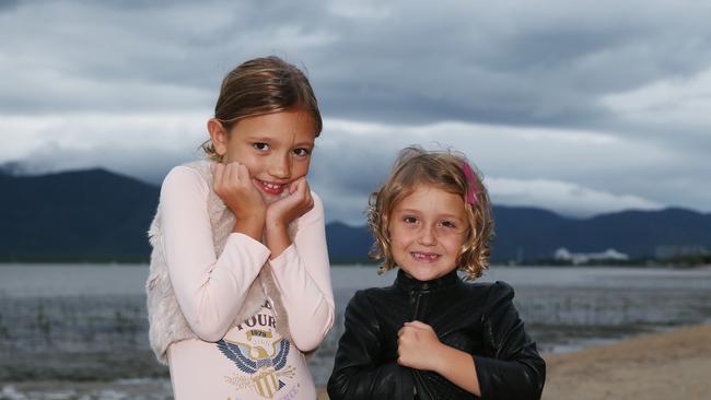 India Scowcroft, 7, and Stella Scowcroft, 9, embraced the opportunity to wear their jackets on a visit to the Esplanade. PICTURE: BRENDAN RADKE