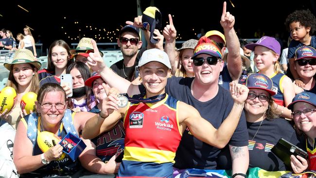 Erin Phillips soaks up Adelaide's win with the Crows cheer squad.