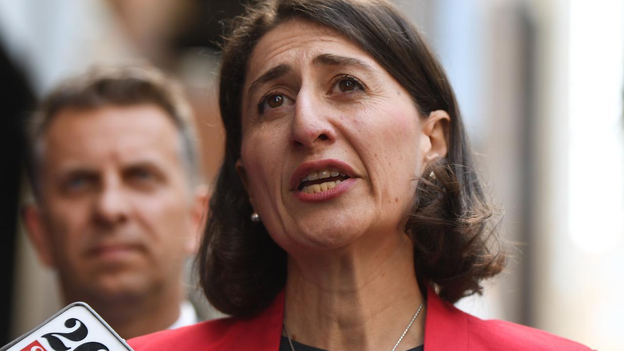 Premier Gladys Berejiklian (front) and Minister for Transport and Infrastructure, Andrew Constance (left) are under pressure to get the light rail open before the next state election in 2019. Picture: Dean Lewins/AAP