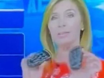 Meteorologist Karen Rogers used her two remotes to make a crude joke aimed at her coworker. Picture: 6ABC