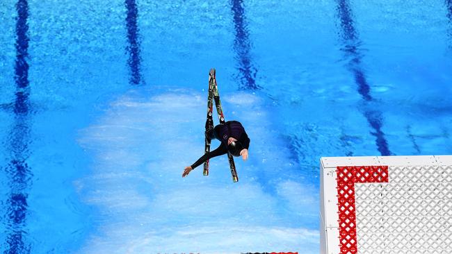 Freestyle skier Airleigh Frigo jumps into a swimming pool at the Sleeman Sports Complex in Brisbane. Picture: NCA NewsWire / Dan Peled