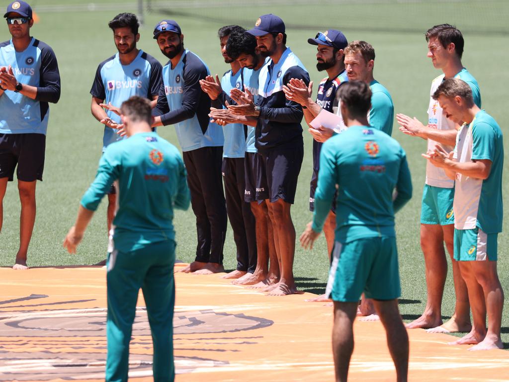 Australia and India take part in a barefoot ceremony in support of Black Lives Matter before the One-Day International cricket match between Australia and India at the SCG. Picture: Brett Costello