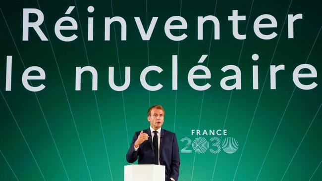 Emmanuel Macron presents a France 2030 investment plan in front of a screen reading “Reinvent nuclear” in Paris. Picture: AFP