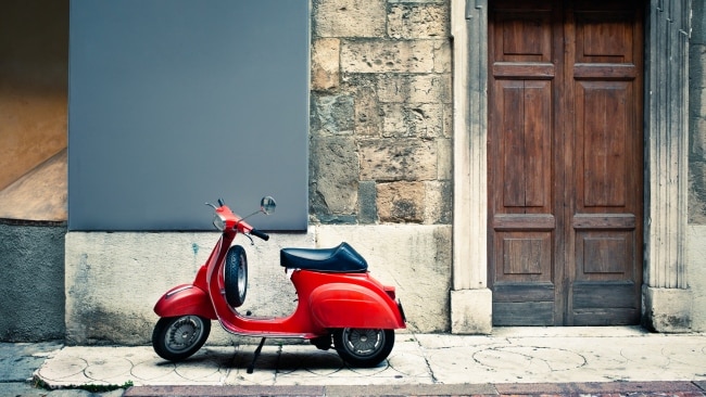 <h2>Crashing a moped in Malta</h2><p>Having never ridden a moped or motorbike before, I figured I'd give it a shot in Malta (it's got to be more relaxed than Bali, I figured). Not wanting to worry the moped rental store owner, when he went through how it all worked, I nodded along confidently, pretending I knew my stuff. </p><p>For the first five minutes of driving it though, I noticed the brake was very weak. Like really weak. I could slow down, but not come to a complete halt (not easily anyway). Weird. Soon enough I came to a road work sign. The road was blocked. I tried to brake, but I could tell I was not going to stop in time. I veered left, thinking this might somehow help. </p><p>Instead of knocking over the orange traffic cones that were in front of me, because I veered left, I bumped into a parked car. I was shunted forward and my knee hit the horn button on my moped, which was broken, and which proceeded to let out a constant beep. </p><p>The only way I could get the beeping to stop was to switch off the ignition. I spent two stressful minutes starting and switching off the moped, until I figured out how to move the sticky beeping button into the off position. I then slunk away, hoping no one had seen.</p><p>I later learned that mopeds and motorbikes actually have two brakes, just like a normal bike, and if you squeeze them both, you should actually come to a stop...</p>