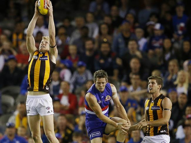 Bob Murphy injures his knee as James Sicily marks before kicking the winning goal. Picture: Michael Klein