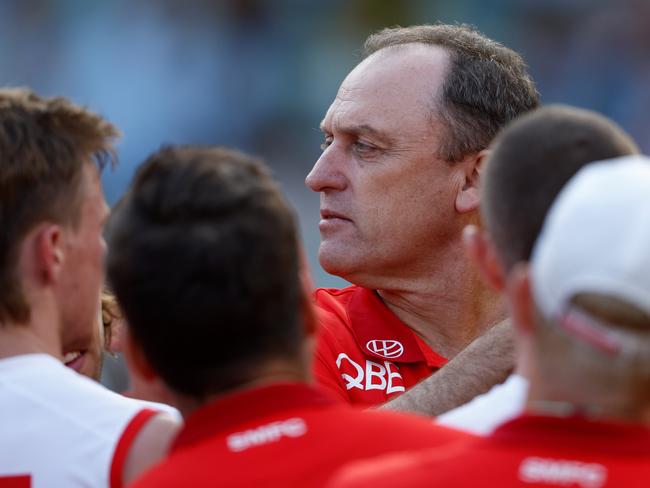 MELBOURNE, AUSTRALIA – MARCH 31: John Longmire, Senior Coach of the Swans addresses his players during the 2024 AFL Round 03 match between the Richmond Tigers and the Sydney Swans at the Melbourne Cricket Ground on March 31, 2024 in Melbourne, Australia. (Photo by Michael Willson/AFL Photos via Getty Images)