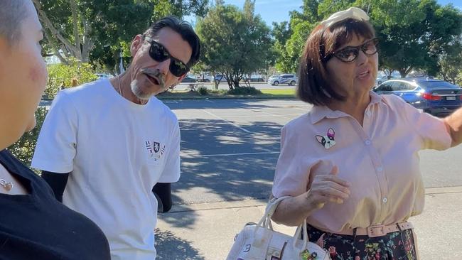 Southport residents question supporters of the homeless in Carey Park about rubbish near the tent city.
