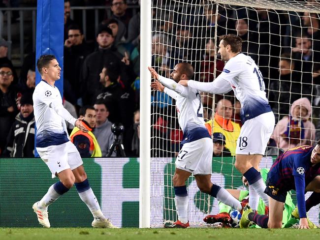 BARCELONA, SPAIN - DECEMBER 11:  Lucas Moura of Tottenham Hotspur (27) celebrates after scoring his team's first goal with Erik Lamela and Fernando Llorente during the UEFA Champions League Group B match between FC Barcelona and Tottenham Hotspur at Camp Nou on December 11, 2018 in Barcelona, Spain.  (Photo by Alex Caparros/Getty Images)