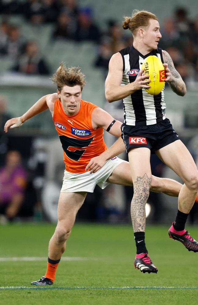 Fleeton trails Beau McCreery. Picture: Michael Willson/AFL Photos via Getty Images