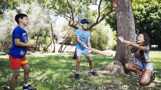 Itai, 7, Yonatan, 11, and Noa Heitner, 13, get some outdoor exercise away from their screens at Matraville in Sydney's inner south. Picture: John Feder