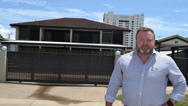 Aaron Power stands in front of the Townsville Holiday Apartments in North Ward bought by the Morris Group for just under $2m.