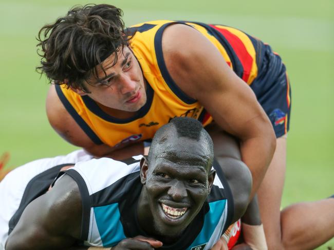 Shane McAdam wraps up Aliir Aliir during the Crows’ pre-season clash with Port Adelaide. Picture: AFL Photos/Getty Images