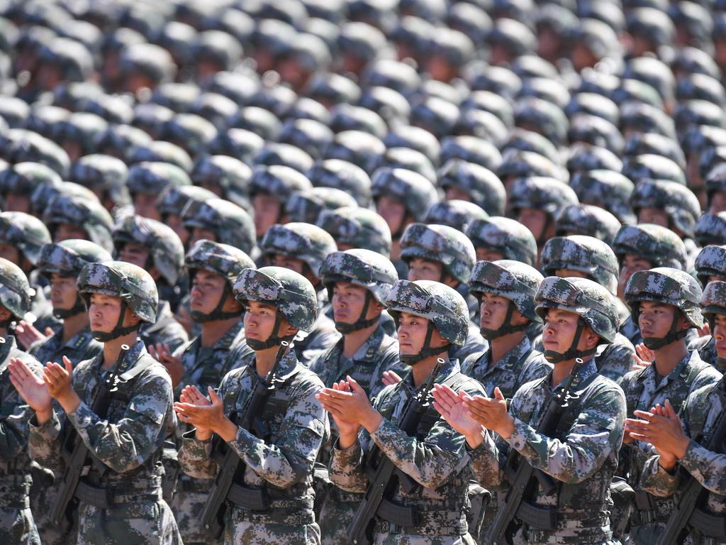 Chinese soldiers applauding during a military parade in May. Picture: AFP