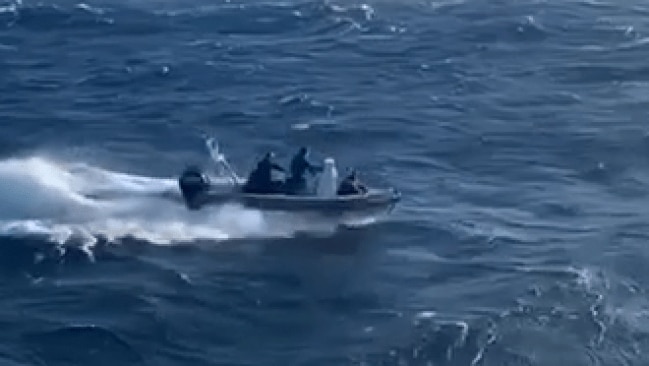 Police deployed a dinghy to rescue the sailors, after some 20 hours at sea. Picture: NSW Police