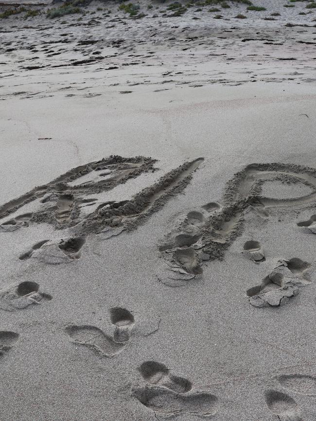 A tribute in the sand. Picture: Riley Walter