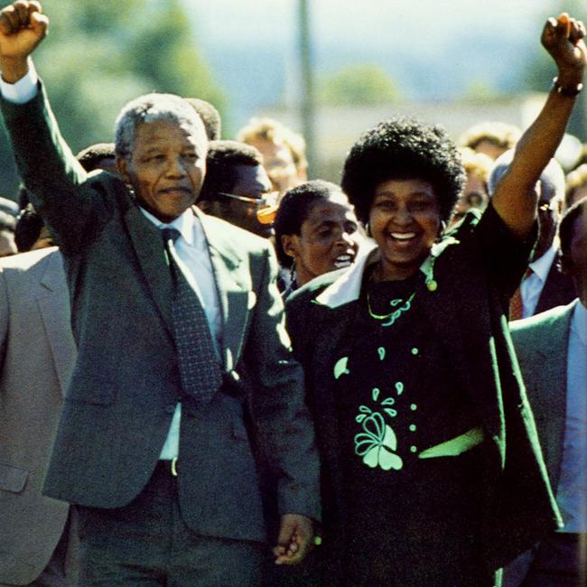 Nelson Mandela and wife Winnie walk hand-in-hand with raised fists after his release from prison. Picture: Greg English